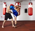 Kickbox fighters sparring in the gym Royalty Free Stock Photo