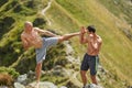 Kickbox fighters sparring in the mountains