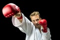 Kickboxer fighter performing a martial arts punch Royalty Free Stock Photo