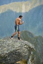 Kickboxer or muay thai fighter training on a mountain cliff Royalty Free Stock Photo