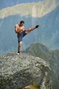 Kickboxer or muay thai fighter training on a mountain cliff Royalty Free Stock Photo