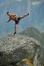 Kickboxer or muay thai fighter training on a mountain cliff Royalty Free Stock Photo