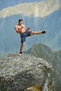 Kickboxer or muay thai fighter training on a mountain cliff Royalty Free Stock Photo