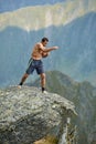 Kickboxer or muay thai fighter training on a mountain cliff Royalty Free Stock Photo