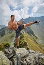 Kickboxer or muay thai fighter training on a mountain Royalty Free Stock Photo