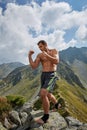 Kickboxer or muay thai fighter training on a mountain Royalty Free Stock Photo