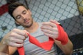 Kickboxer wraps hands red bandages Royalty Free Stock Photo