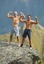 Kickboxers or muay thai fighters on a mountain cliff Royalty Free Stock Photo