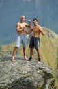 Kickboxers or muay thai fighters on a mountain cliff Royalty Free Stock Photo