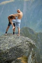 Kickboxers or muay thai fighters training on a mountain cliff