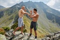 Kickboxers or muay thai fighters training in the mountains