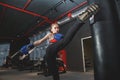 Kickboxing woman punching kicking bag at the gym Royalty Free Stock Photo