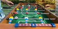 Kicker game players have fun for playing table football soccer, Soccer table game Royalty Free Stock Photo