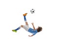 Little boy, football soccer player in action, motion training isolated on white studio background. Concept of sport Royalty Free Stock Photo