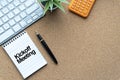 KICKOFF MEETING text with notepad, decorative plant, keyboard and fountain pen on wooden background Royalty Free Stock Photo
