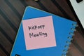 Kickoff Meeting write on sticky notes isolated on Wooden Table Royalty Free Stock Photo