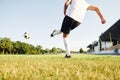 Kicks the ball. Young soccer player have training on the sportive field Royalty Free Stock Photo