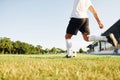 Kicks the ball. Young soccer player have training on the sportive field Royalty Free Stock Photo