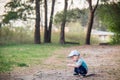 Kid alone playing in forest