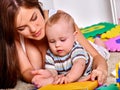 Kid baby boy plying with puzzle toy on floor Royalty Free Stock Photo