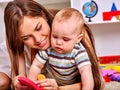 Kid baby boy plying with puzzle toy on floor Royalty Free Stock Photo