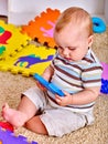 Kid baby boy plying with puzzle toy on floor Royalty Free Stock Photo