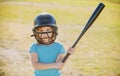 Kid baseball ready to bat. Child batter about to hit a pitch during a baseball game. Royalty Free Stock Photo