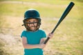 Kid baseball ready to bat. Child batter about to hit a pitch during a baseball game. Royalty Free Stock Photo
