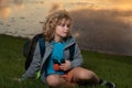 Kid with binoculars hiking at nature. Little explorer. Outdoor recreation and adventures with kids. Child tourist on Royalty Free Stock Photo