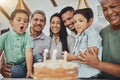 Kid, birthday candles and child with cake at a house at a party with food and celebration. Children, celebrate event and Royalty Free Stock Photo