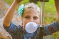 Kid blowing chewing gum bubbles Royalty Free Stock Photo