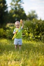 Kid blowing soap bubbles Royalty Free Stock Photo