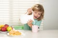 Kid bot eating meal. Healthy nutrition for children. Child enjoy eating for breakfast or dinner with appetite. Fuuny