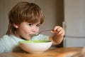 Kid boy eating healthy food at home. Happy child have a breakfast. Portrait of beautiful child having breakfast at home Royalty Free Stock Photo