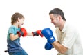 Kid boy and father play boxing