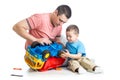 Kid boy and his daddy fixing toy trunk Royalty Free Stock Photo