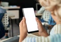 Kid boy junior school student using phone with mockup screen in classroom. Royalty Free Stock Photo