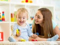 Kid boy and mom playing with construction toys Royalty Free Stock Photo