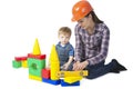 Kid boy and mother play together with construction set toy Royalty Free Stock Photo