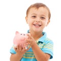 Kid, boy and piggy bank for change, portrait and smiling in studio by white background. Happy male person, child and