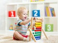 Kid boy playing with abacus