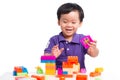 Kid boy playing with blocks from toy constructor isolated Royalty Free Stock Photo