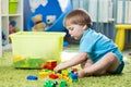 Kid boy playing with construction set Royalty Free Stock Photo