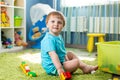 Kid boy playing with construction toys indoor Royalty Free Stock Photo