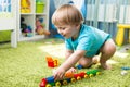 Kid boy playing with construction toys indoor Royalty Free Stock Photo