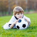 Kid boy playing soccer with football Royalty Free Stock Photo