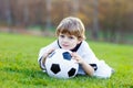 Kid boy playing soccer with football Royalty Free Stock Photo