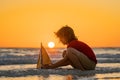 Kid boy playing with toy boat in sea water. Happy holiday by the sea. Kid dreaming about sailing. Happy kid playing with Royalty Free Stock Photo