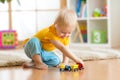 Kid boy playing with toys indoor Royalty Free Stock Photo