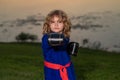 Kid boy practicing box outdoor. Sport karate box kids. Little boy wearing kimono doing karate in park. Child with boxing Royalty Free Stock Photo